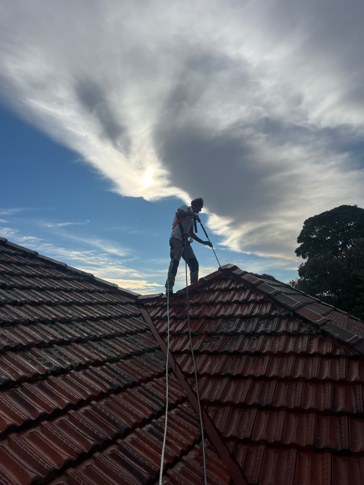 BRIMO worker restoring a red tiled roof